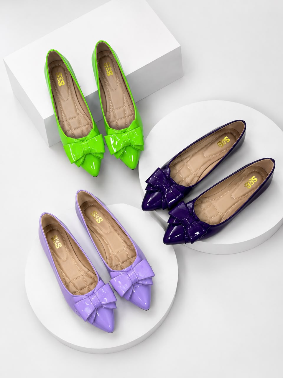 Assorted flat shoes on an oval tray